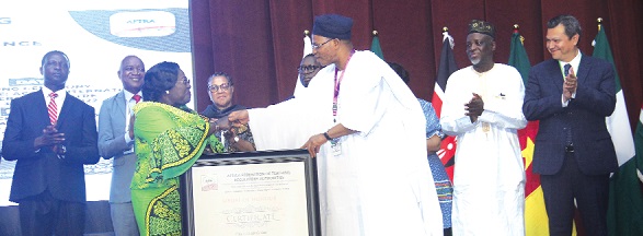 Prof. Josiah Ajiboye (right), Deputy President, Africa Federation of Teaching Regulatory Authorities, presenting the citation for the award to Akosua Frema Osei-Opare (left), Chief of Staff at the Office of the President. Picture: BENEDICT OBUOBI